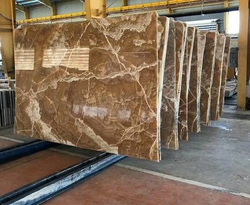 Sharma Exports natural stone yard in Attibele Bengaluru with stacked granite and marble slabs
